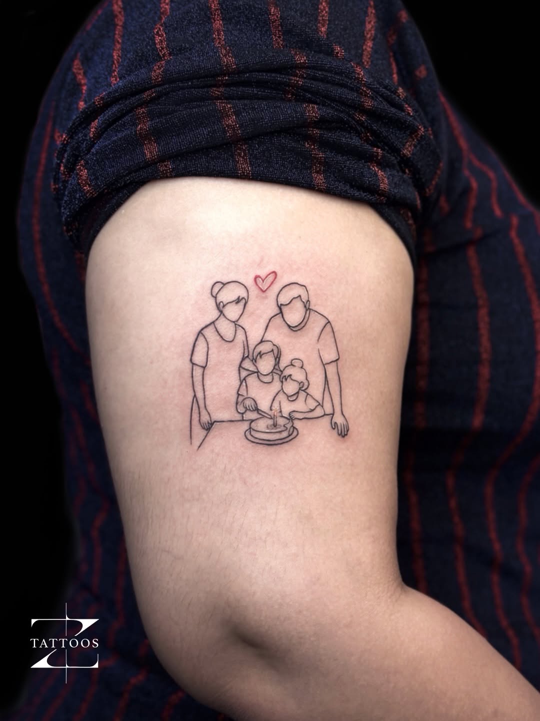 Single-line family portrait with a small red heart, upper arm placement.