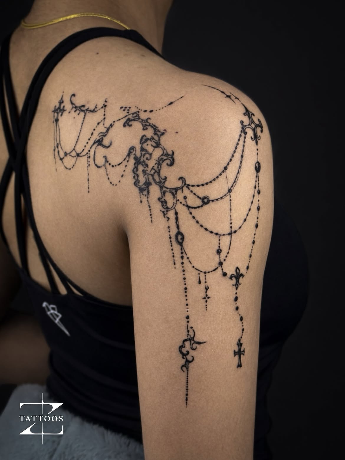 Rosary and Gothic shoulder piece designed to flow like dark jewelry.
