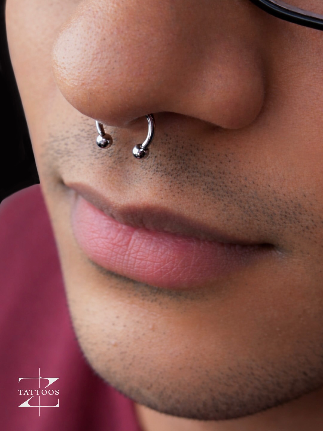 Tragus and anti-tragus piercing set with minimal jewellery.